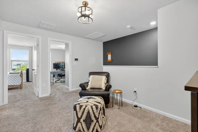 a room with furniture and a flat screen tv