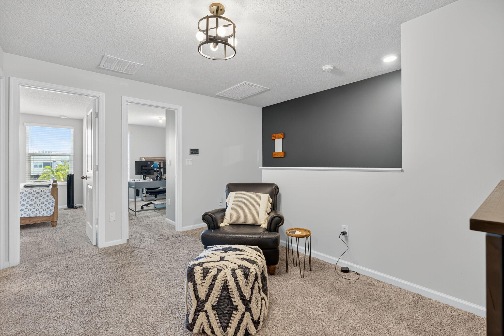 3942 Southeast Caladium Court Stuart, FL 34997 - Photo 14 of 38 a room with furniture and a flat screen tv