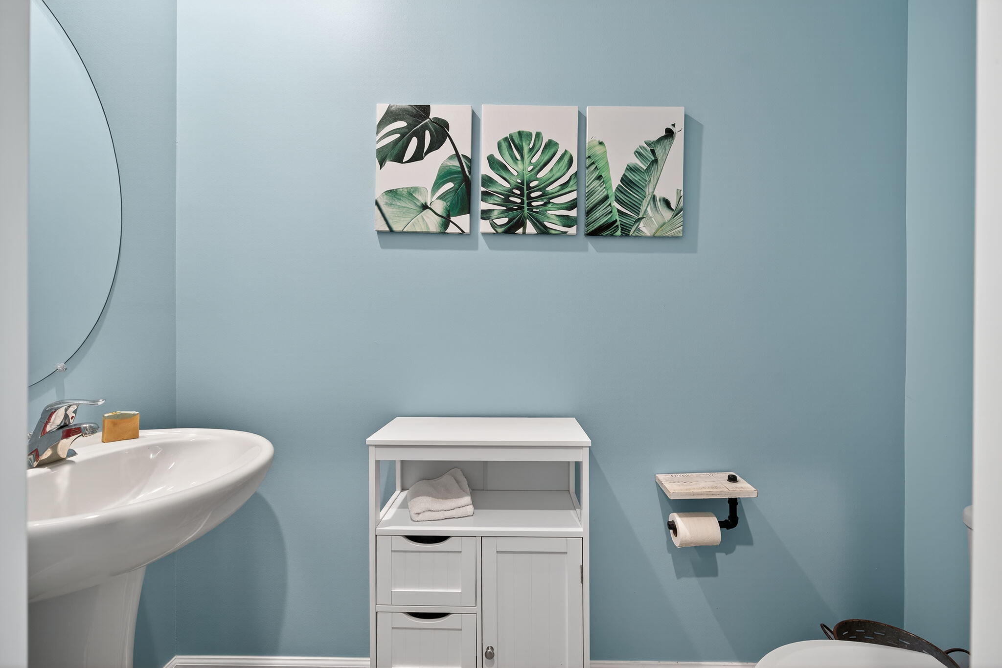 3942 Southeast Caladium Court Stuart, FL 34997 - Photo 17 of 38 a bathroom with a sink mirror and toilet