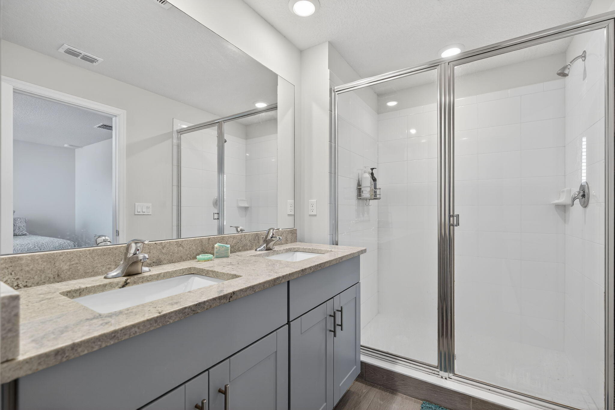 3942 Southeast Caladium Court Stuart, FL 34997 - Photo 23 of 38 a bathroom with a granite countertop sink mirror and double