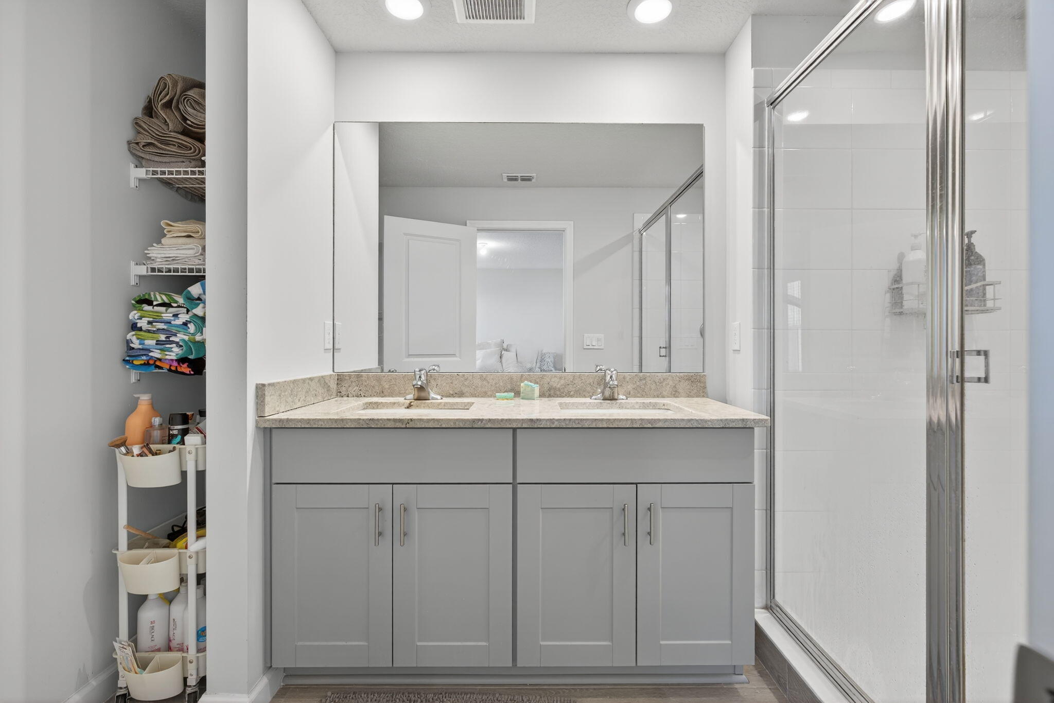 3942 Southeast Caladium Court Stuart, FL 34997 - Photo 24 of 38 a bathroom with a sink and a mirror