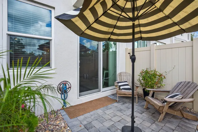 a swimming pool with outdoor seating and yard