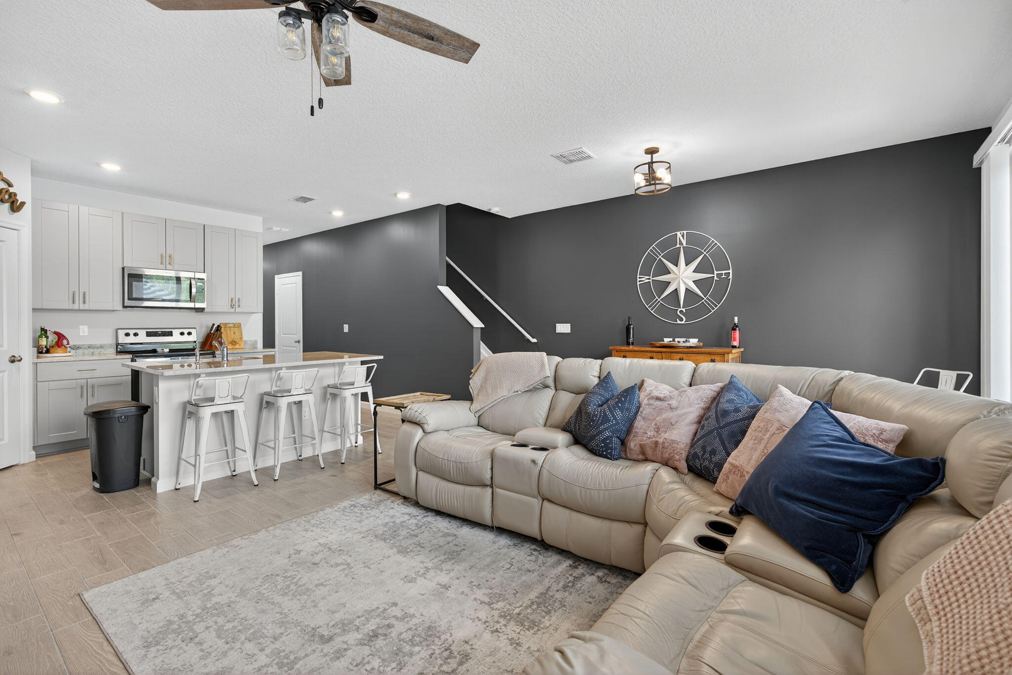 3942 Southeast Caladium Court Stuart, FL 34997 - Photo 8 of 38 a living room with furniture and kitchen view