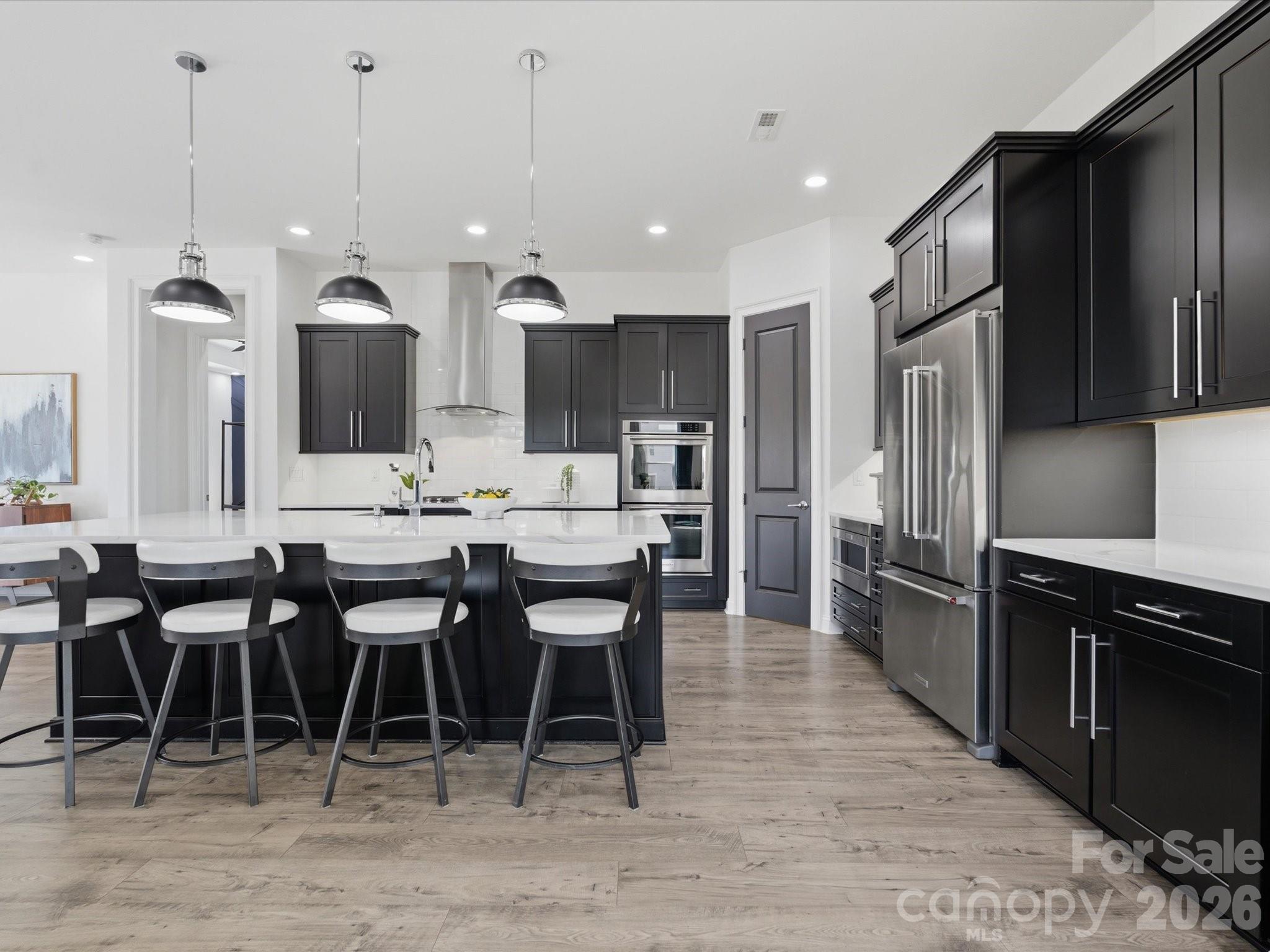 7237 Twelve Mile Creek Road Lancaster, SC 29720 - Photo 12 of 47 a large kitchen with lots of furniture a sink appliances and a dining table
