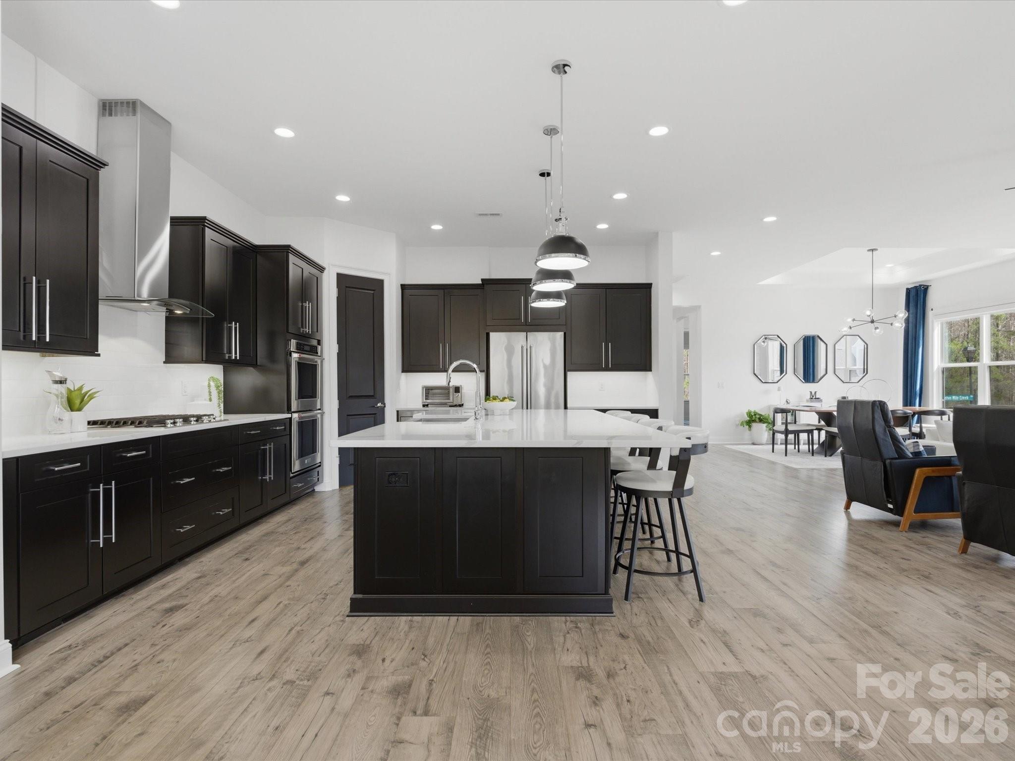 7237 Twelve Mile Creek Road Lancaster, SC 29720 - Photo 13 of 47 a large kitchen with stainless steel appliances a large counter top a sink and a refrigerator
