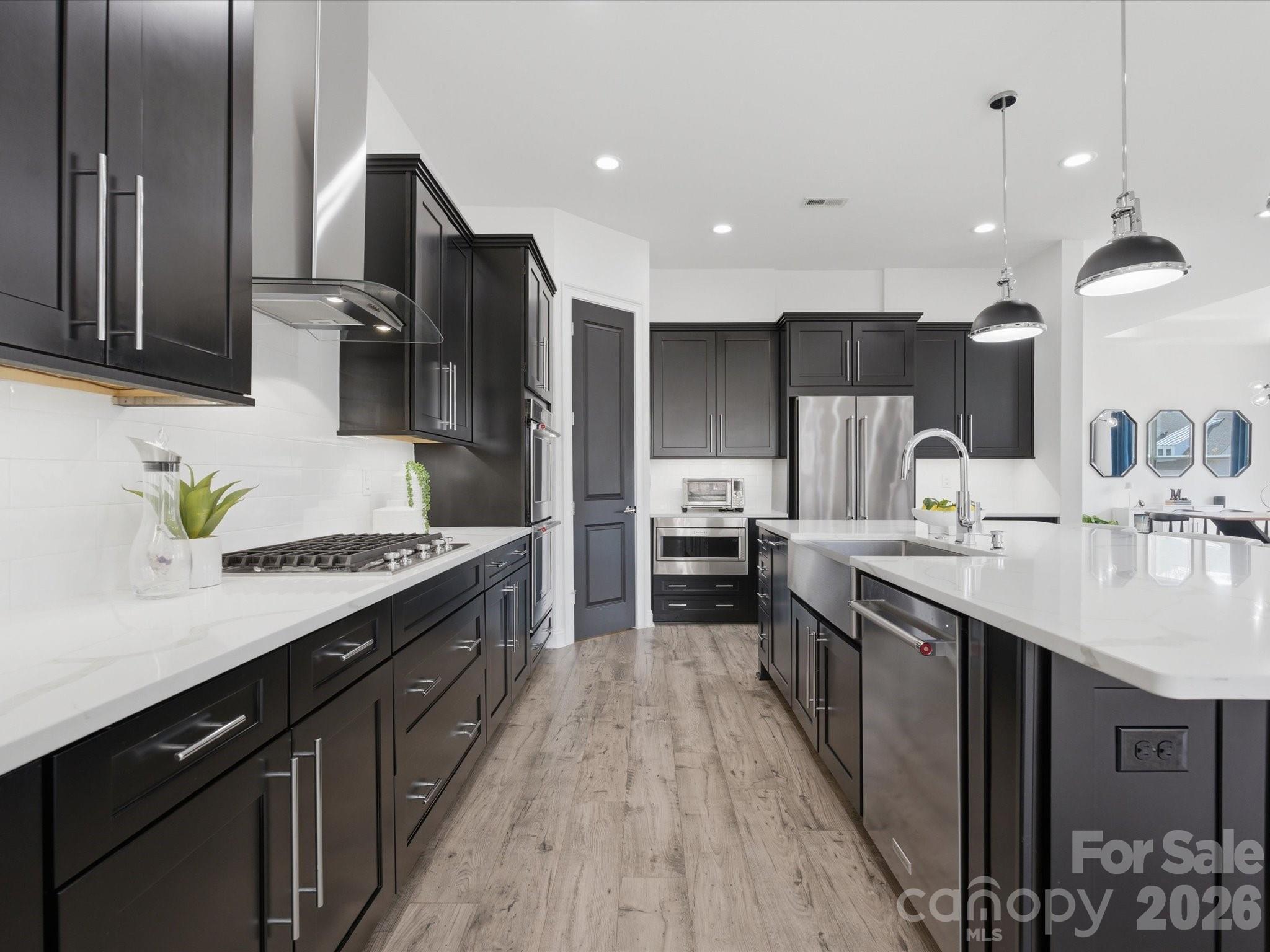 7237 Twelve Mile Creek Road Lancaster, SC 29720 - Photo 14 of 47 a kitchen with stainless steel appliances a sink stove and refrigerator