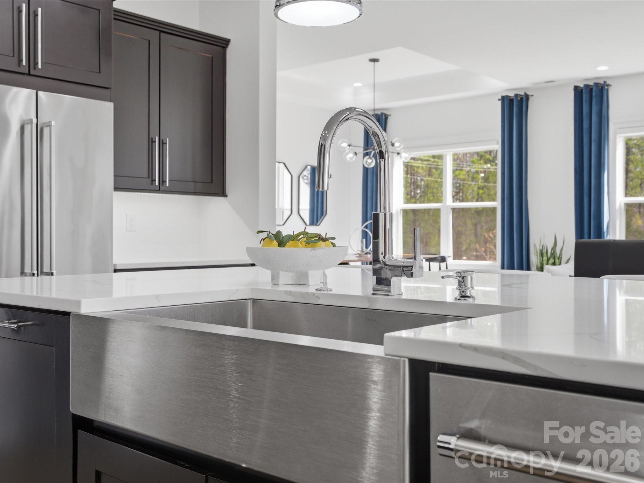 7237 Twelve Mile Creek Road Lancaster, SC 29720 - Photo 16 of 47 a kitchen with a sink a window and chairs