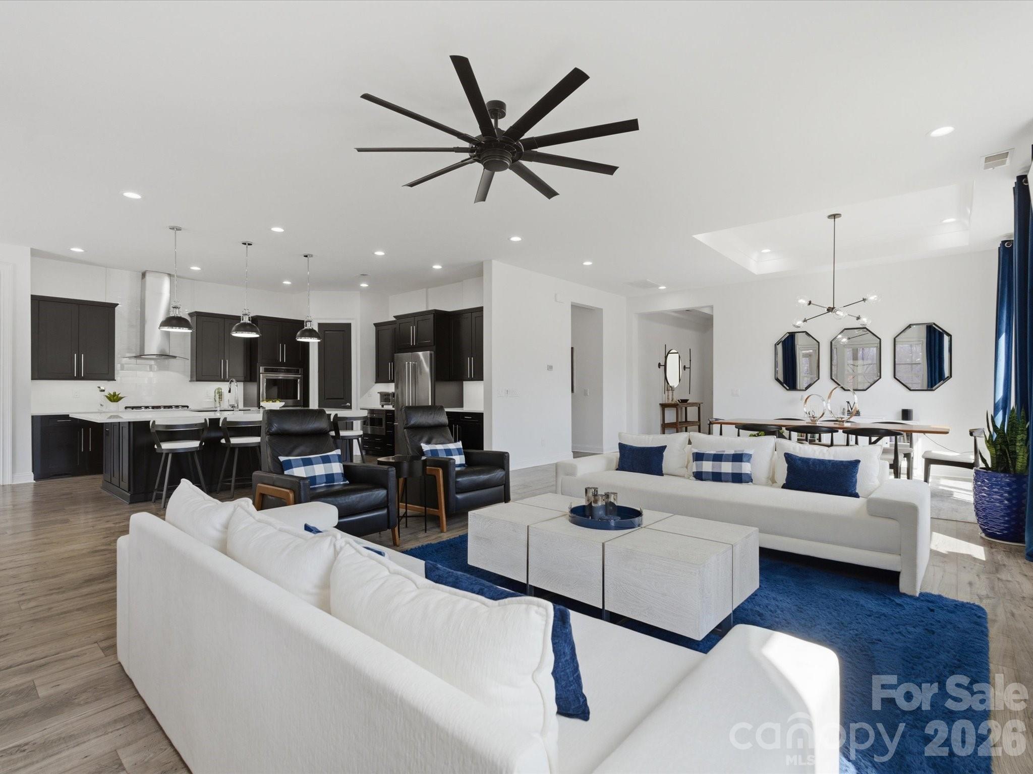 7237 Twelve Mile Creek Road Lancaster, SC 29720 - Photo 21 of 47 a living room with furniture kitchen view and a chandelier
