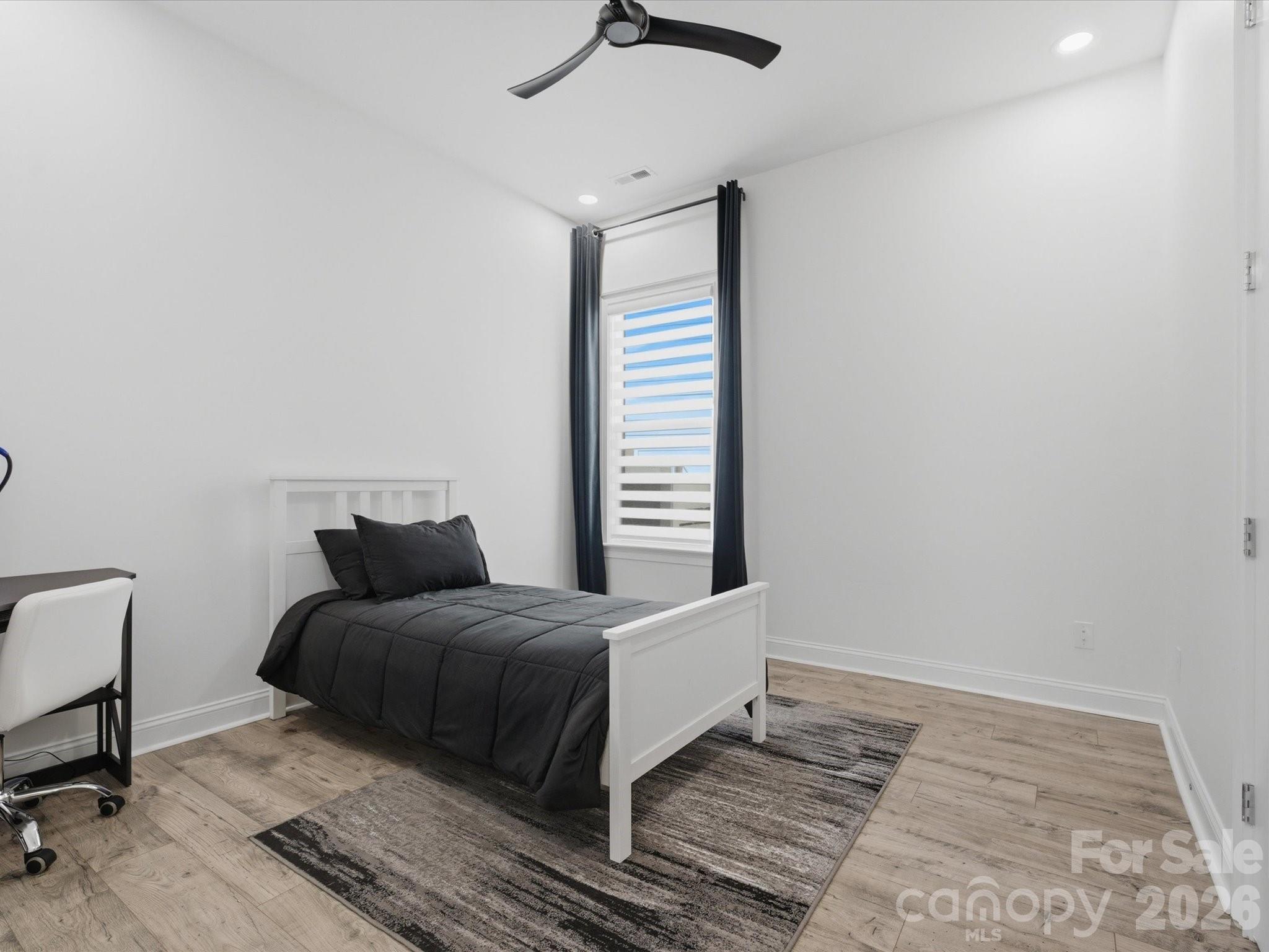 7237 Twelve Mile Creek Road Lancaster, SC 29720 - Photo 30 of 47 a bedroom with a bed and a chair