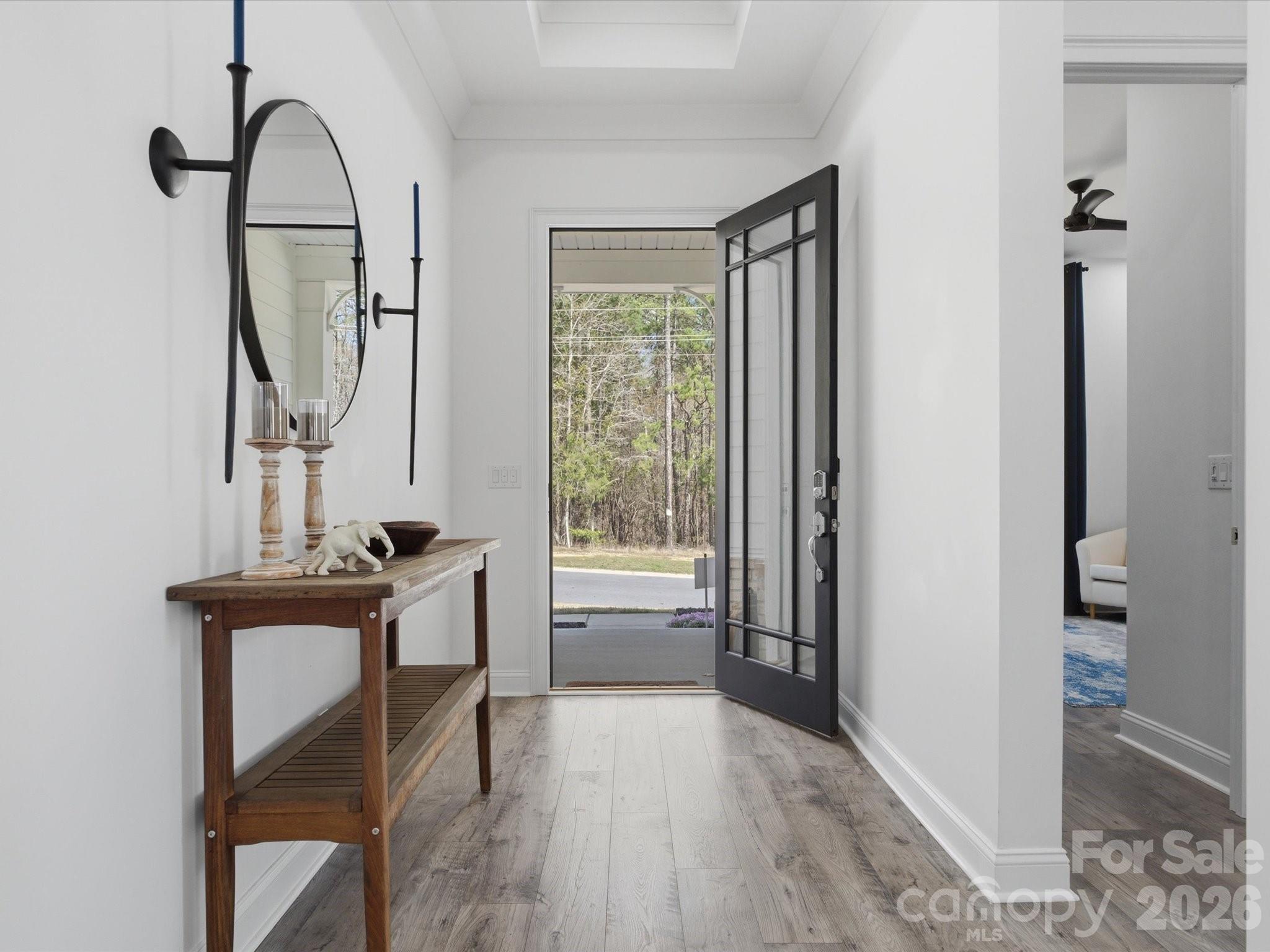 7237 Twelve Mile Creek Road Lancaster, SC 29720 - Photo 4 of 47 a view of a hallway with wooden floor windows and a livingroom