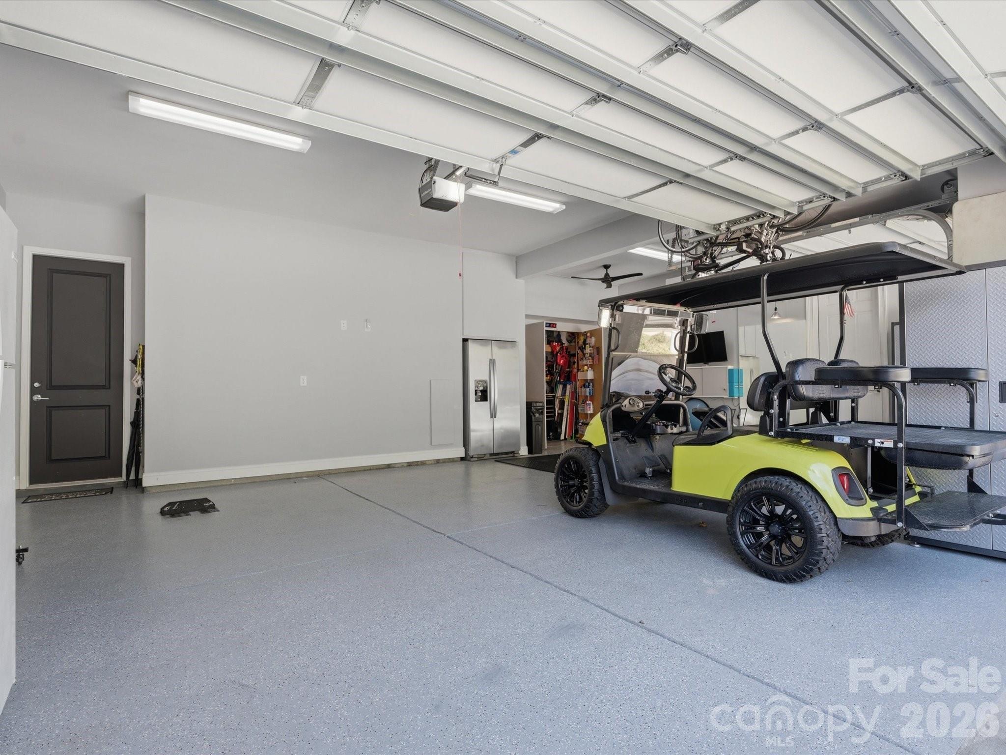 7237 Twelve Mile Creek Road Lancaster, SC 29720 - Photo 42 of 47 a view of parking garage with cars and a bike