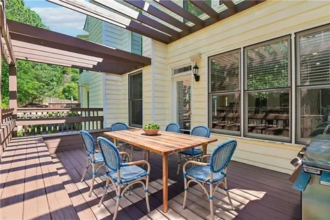 a view of a patio with a table and chairs