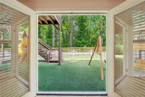 a view of a deck and a backyard