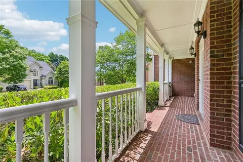 a view of a balcony with wooden floor