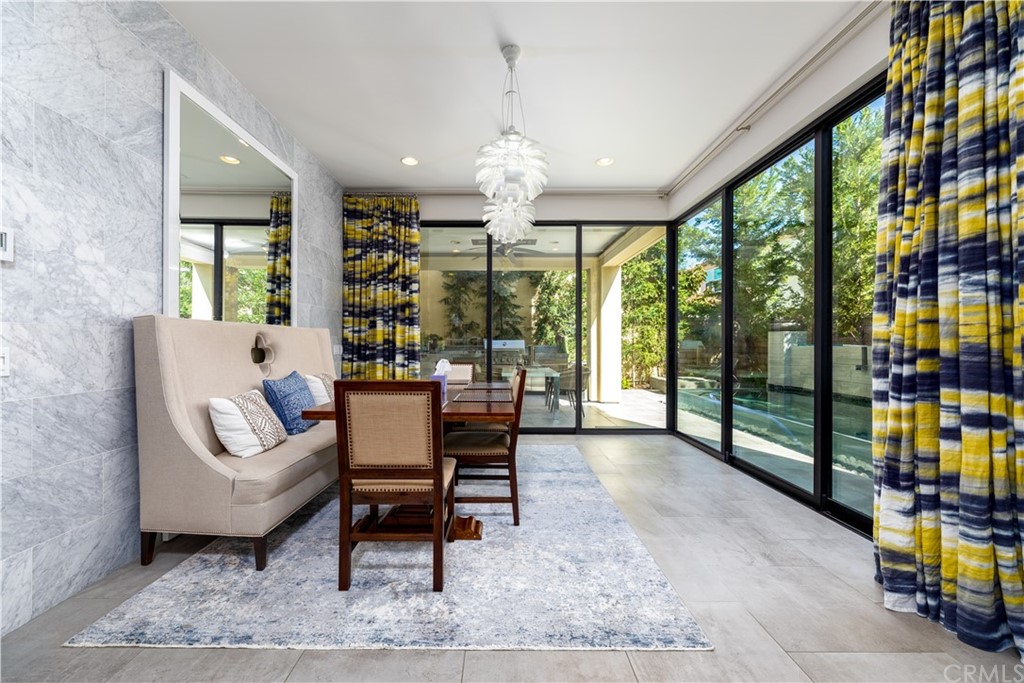 35 Zion Drive Lake Forest, CA 92630 - Photo 14 of 41 a living room with furniture and a floor to ceiling window