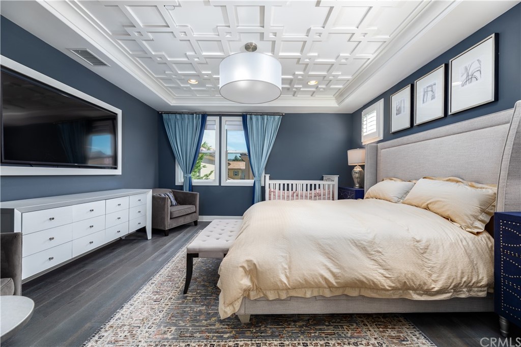 35 Zion Drive Lake Forest, CA 92630 - Photo 21 of 41 a spacious bedroom with a bed and a flat screen tv