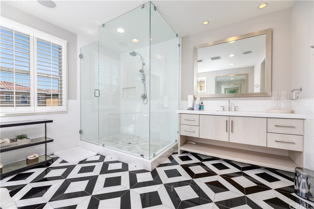 35 Zion Drive Lake Forest, CA 92630 - Photo 25 of 41 a kitchen with a checkered floor and white cabinets