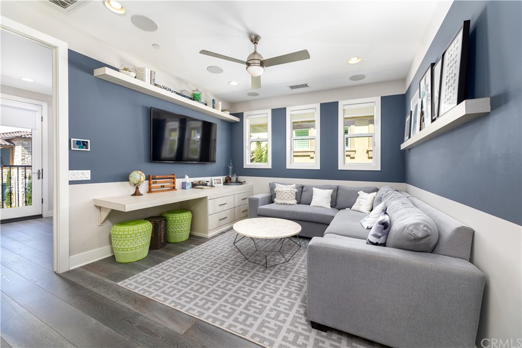 35 Zion Drive Lake Forest, CA 92630 - Photo 27 of 41 a living room with furniture a flat screen tv and a window