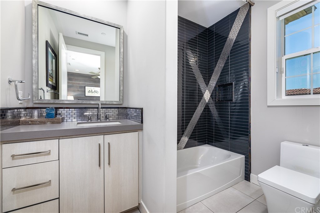 35 Zion Drive Lake Forest, CA 92630 - Photo 31 of 41 a bathroom with a bathtub sink vanity and toilet