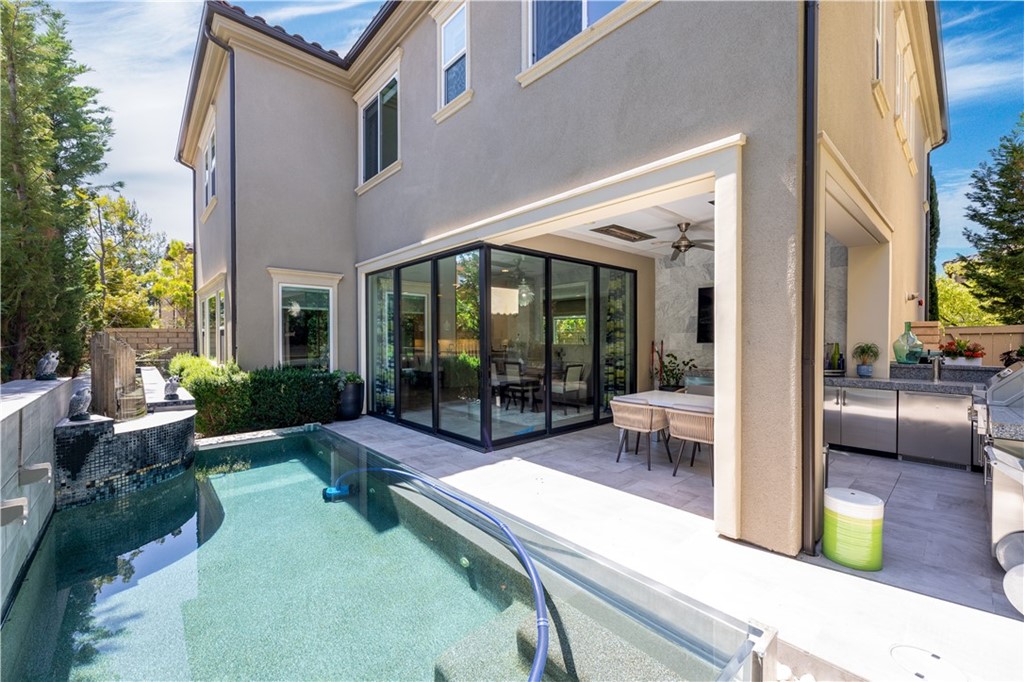 35 Zion Drive Lake Forest, CA 92630 - Photo 40 of 41 a view of a house with backyard sitting area and garden