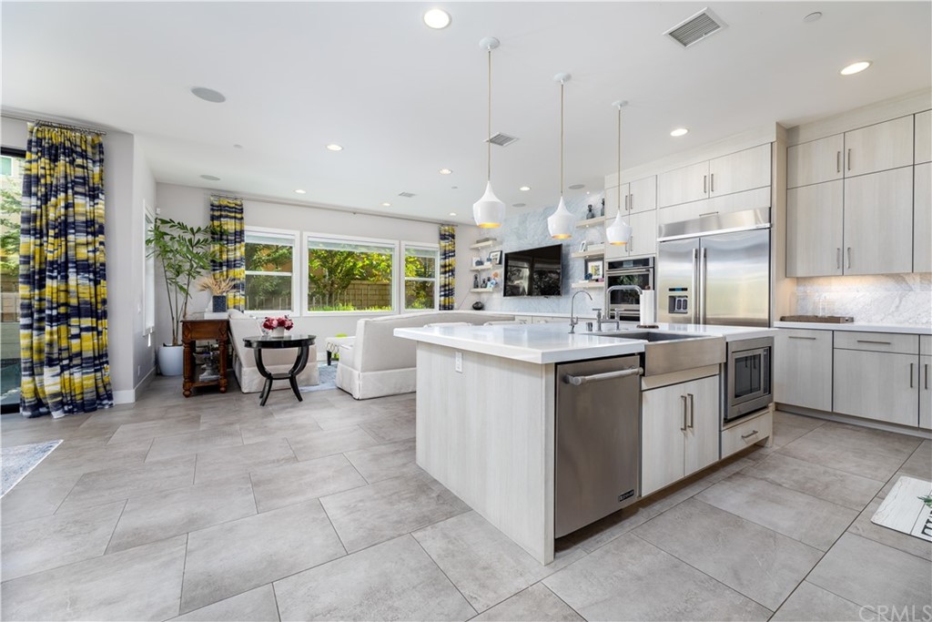 35 Zion Drive Lake Forest, CA 92630 - Photo 7 of 41 a kitchen that has a lot of cabinets in it and appliances