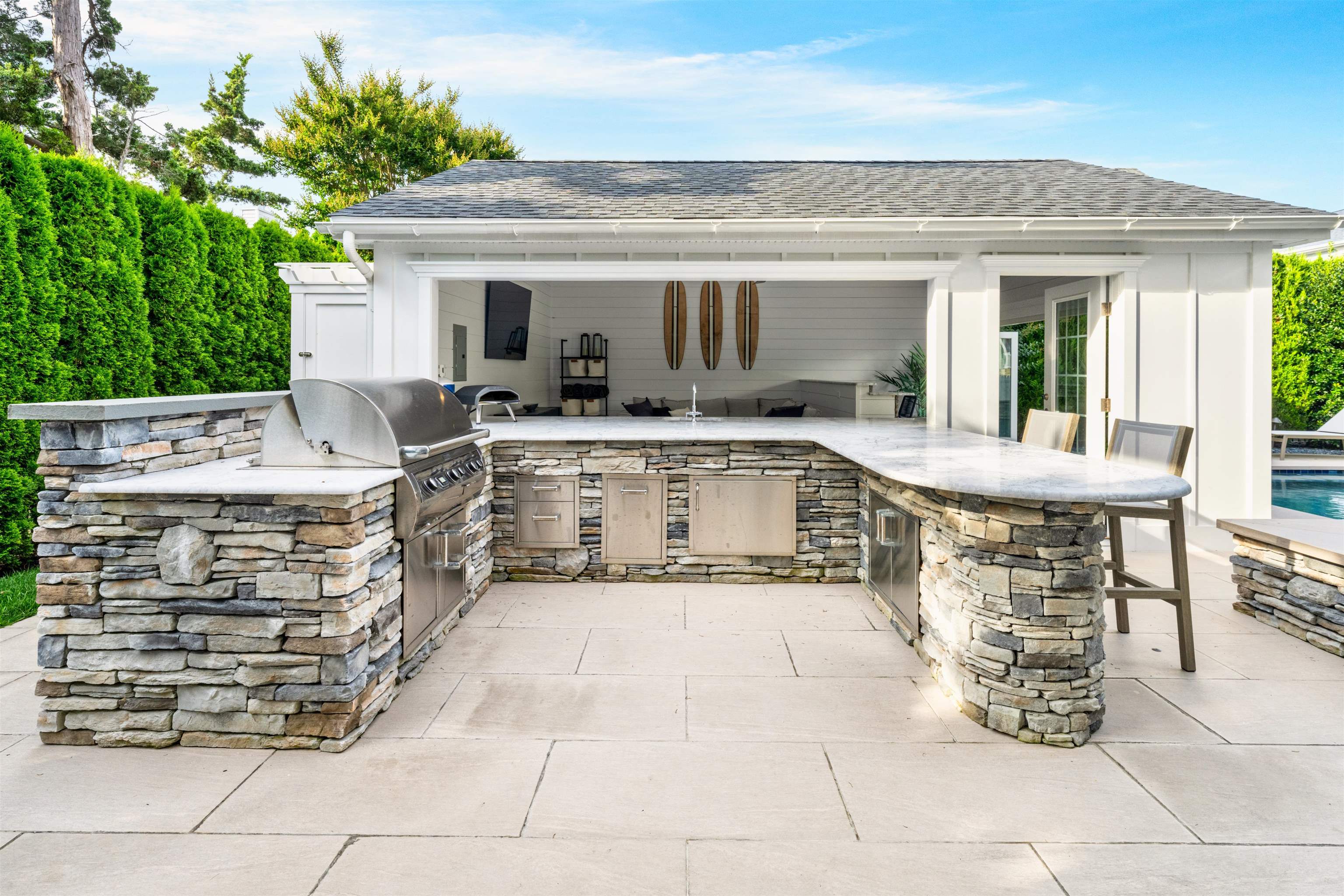 246 103rd Street Stone Harbor, NJ 08247 - Photo 12 of 50 a view of a patio with table and chairs potted plants with wooden fence
