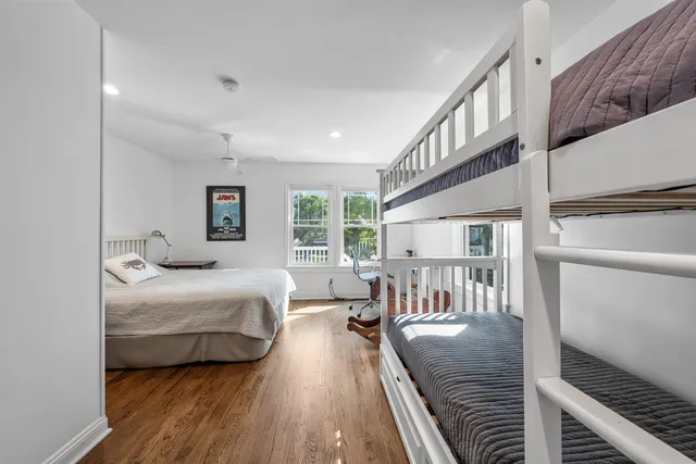 a bedroom with furniture and a window