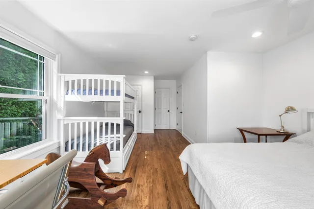 a bedroom with furniture and a window