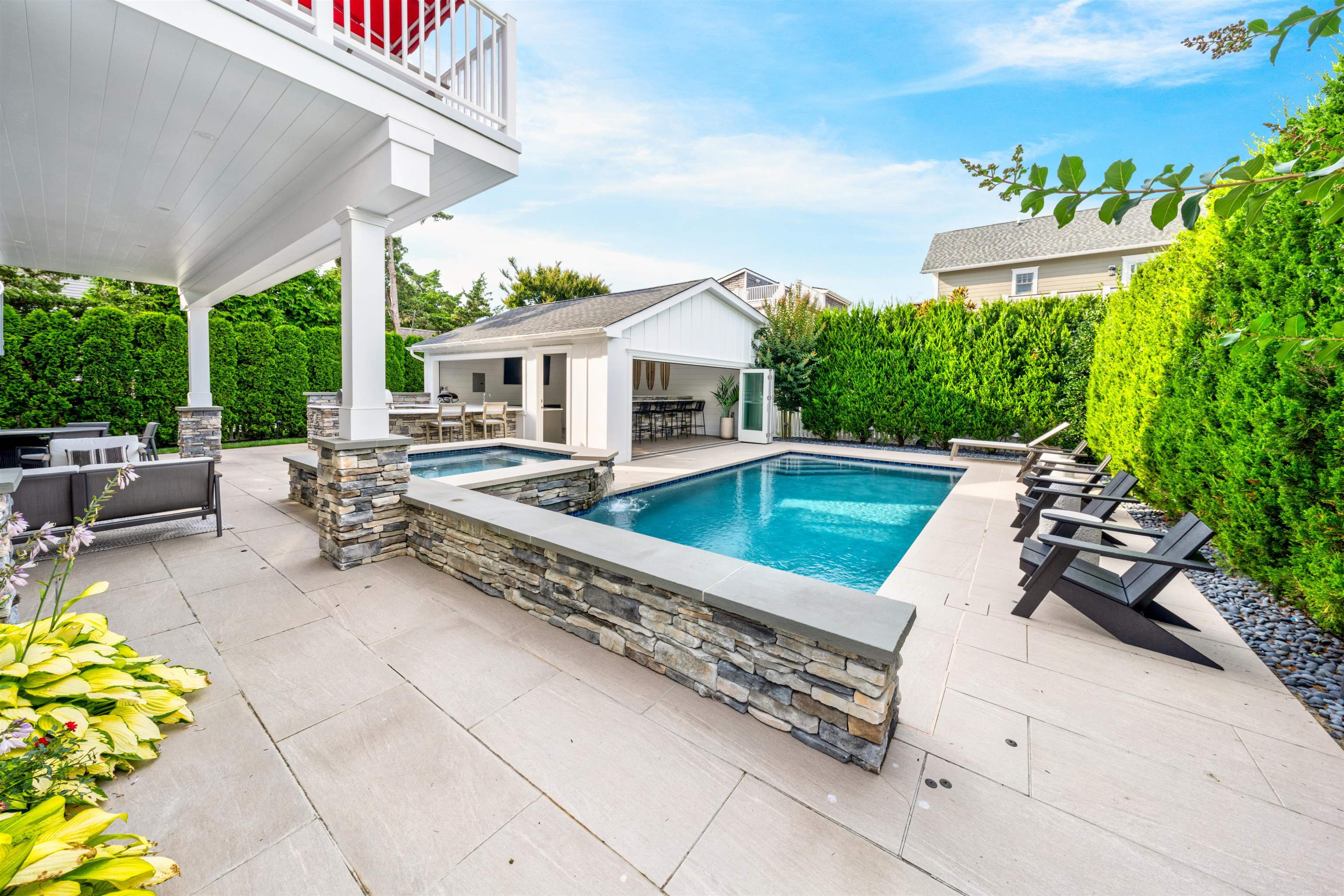 246 103rd Street Stone Harbor, NJ 08247 - Photo 4 of 50 a view of a patio with couches table and chairs and potted plants