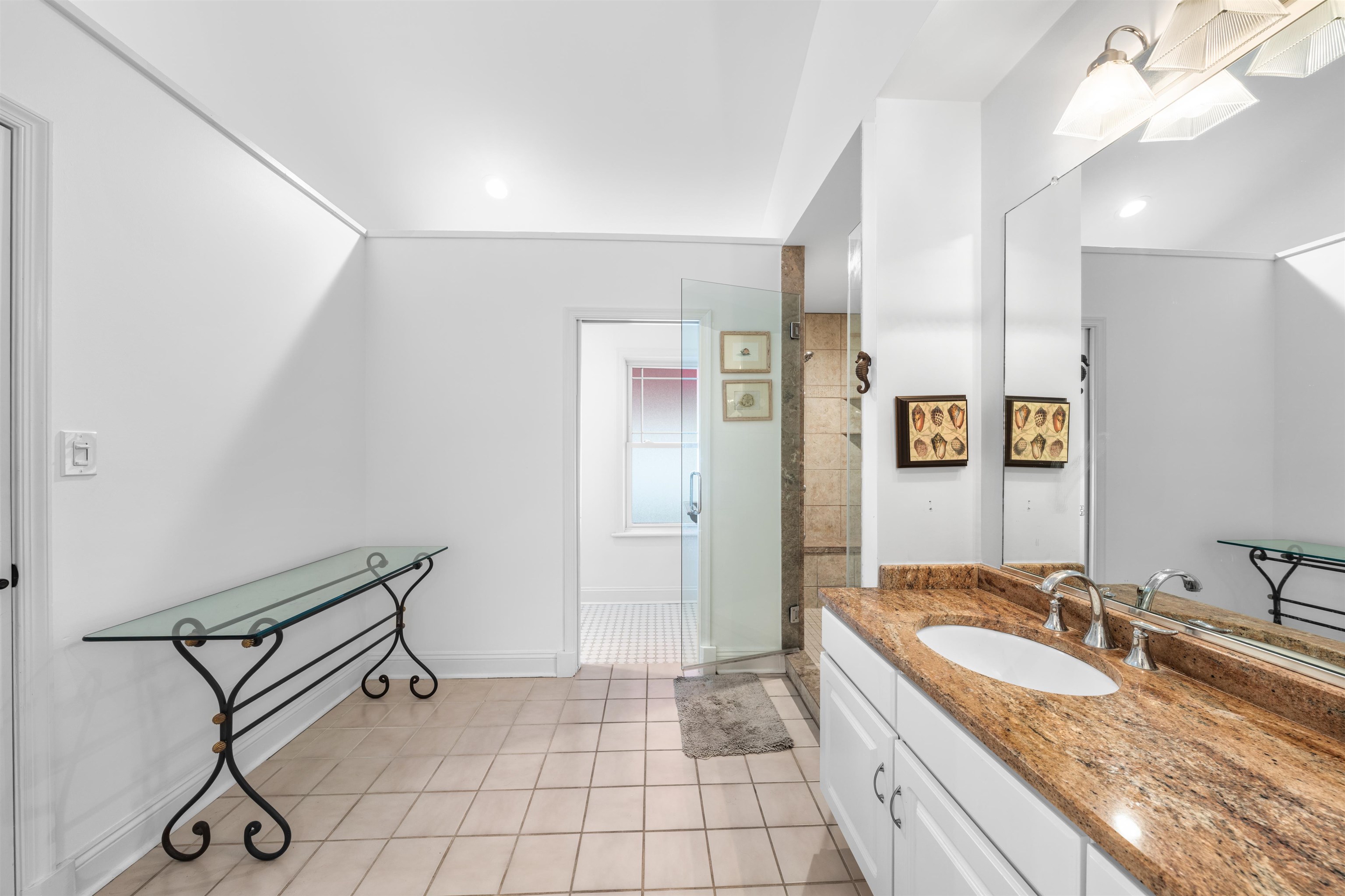 246 103rd Street Stone Harbor, NJ 08247 - Photo 41 of 50 a bathroom with a granite countertop sink and a mirror