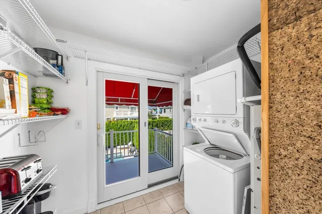 a room that has a washer and dryer next to a window