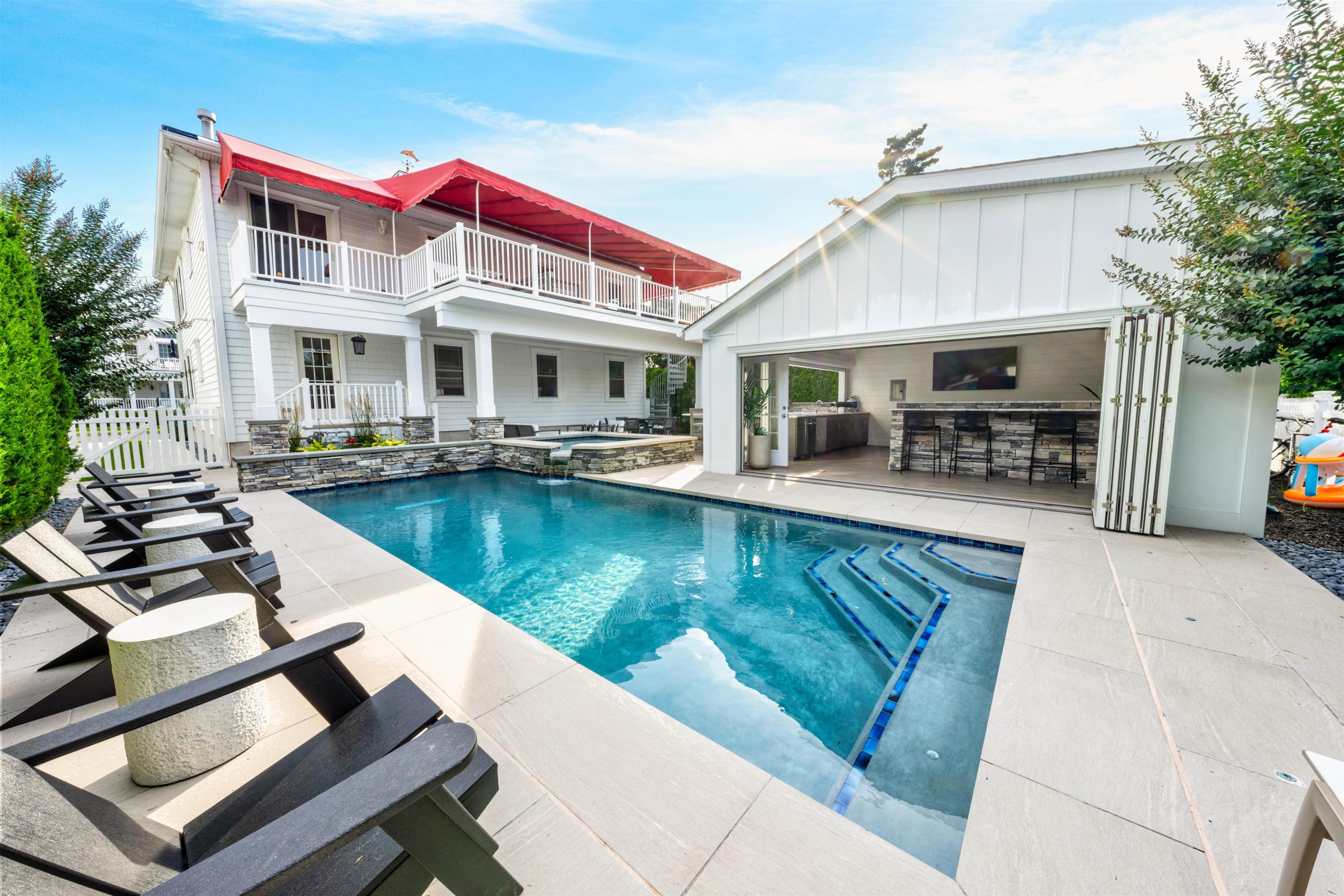 246 103rd Street Stone Harbor, NJ 08247 - Photo 47 of 50 a view of a house with swimming pool and sitting area