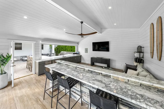 a kitchen with granite countertop lots of counter top space and furniture