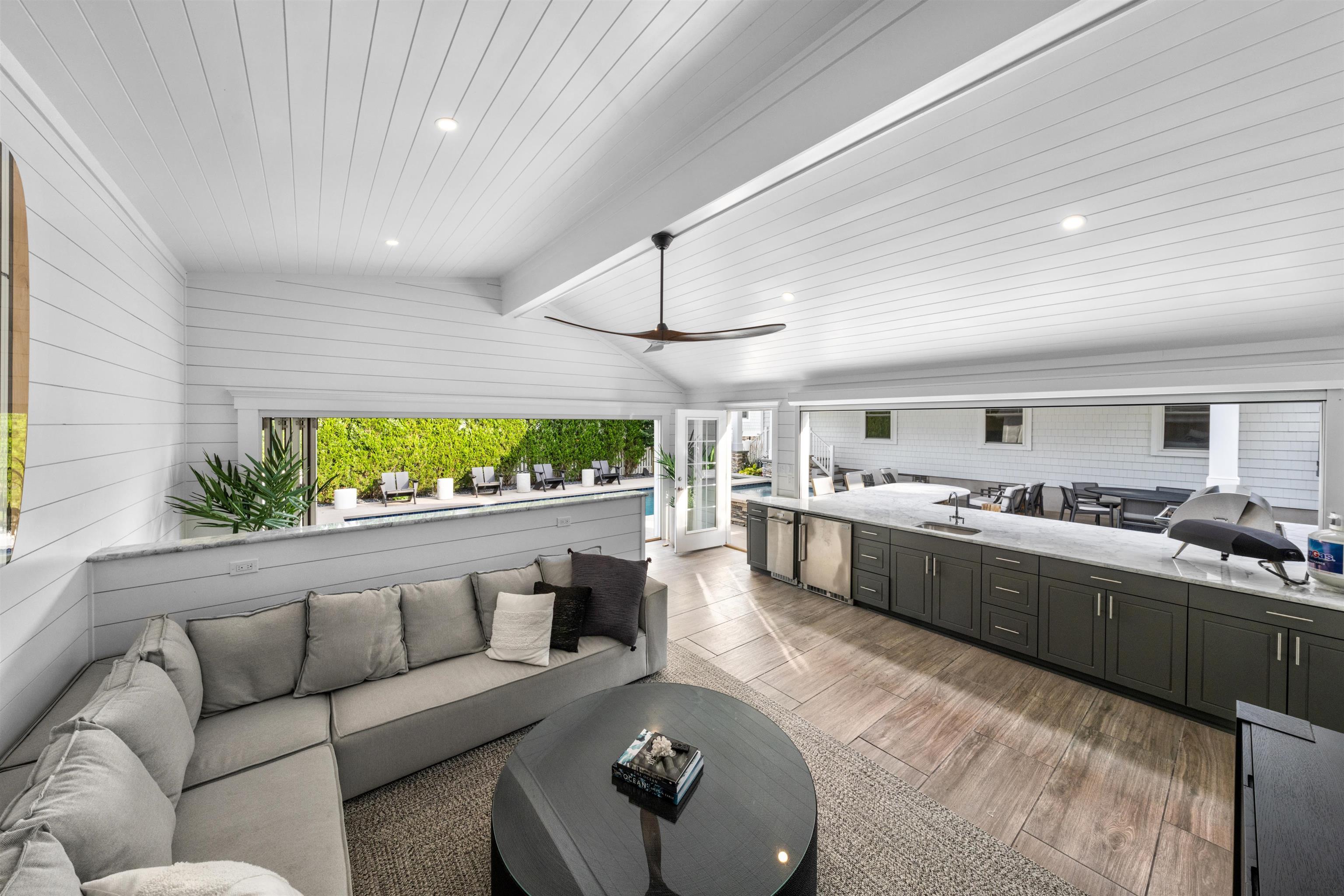 246 103rd Street Stone Harbor, NJ 08247 - Photo 7 of 50 a living room with furniture and a kitchen view