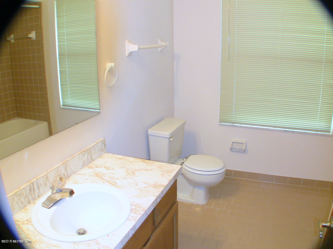 10844 Reading Road Jacksonville, FL 32257 - Photo 8 of 10 a bathroom with a sink a toilet and tub