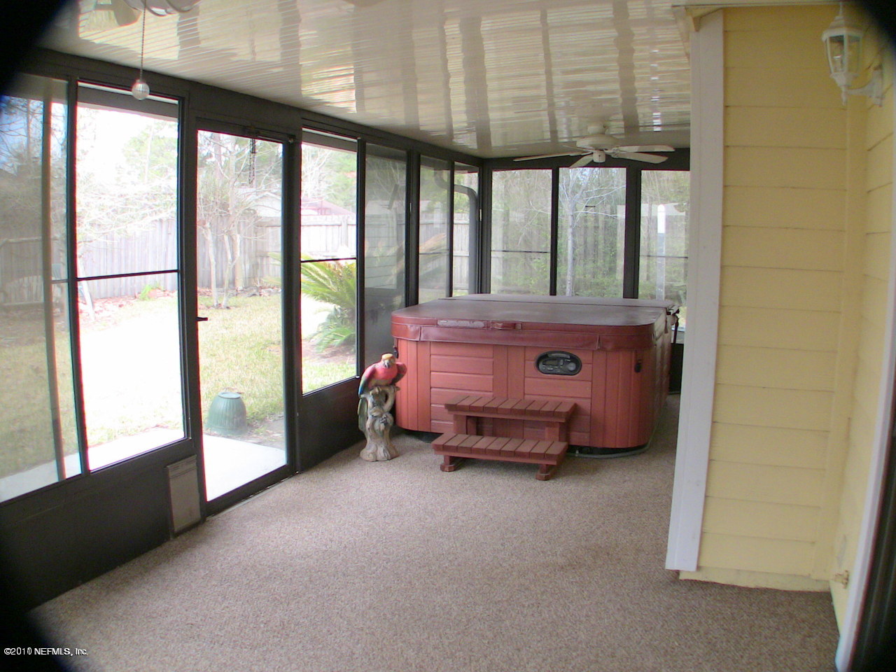 10844 Reading Road Jacksonville, FL 32257 - Photo 9 of 10 a room with a bed and large windows
