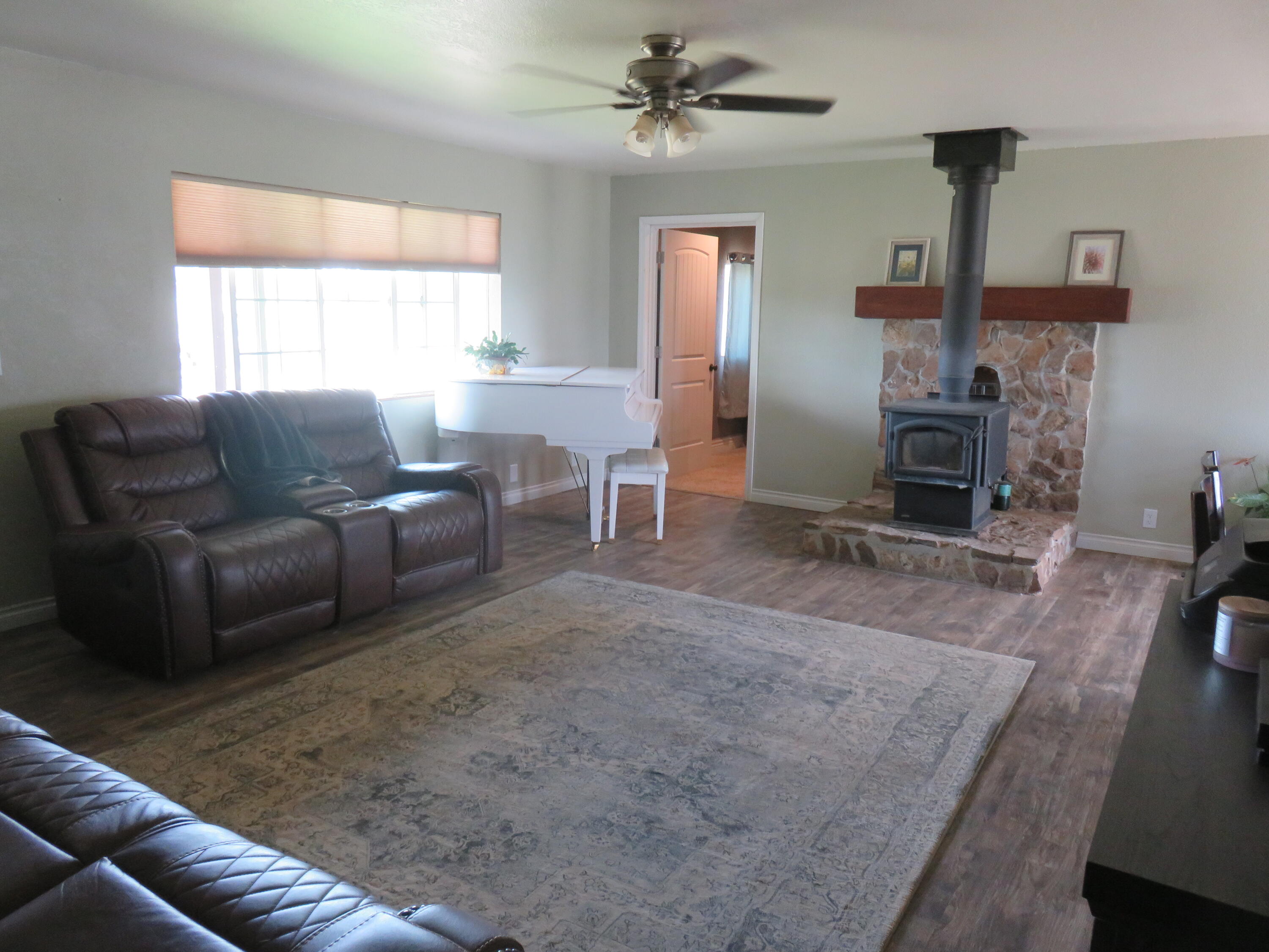 3798 County Road 91 Lookout, CA 96054 - Photo 18 of 54 a living room with furniture and a fireplace