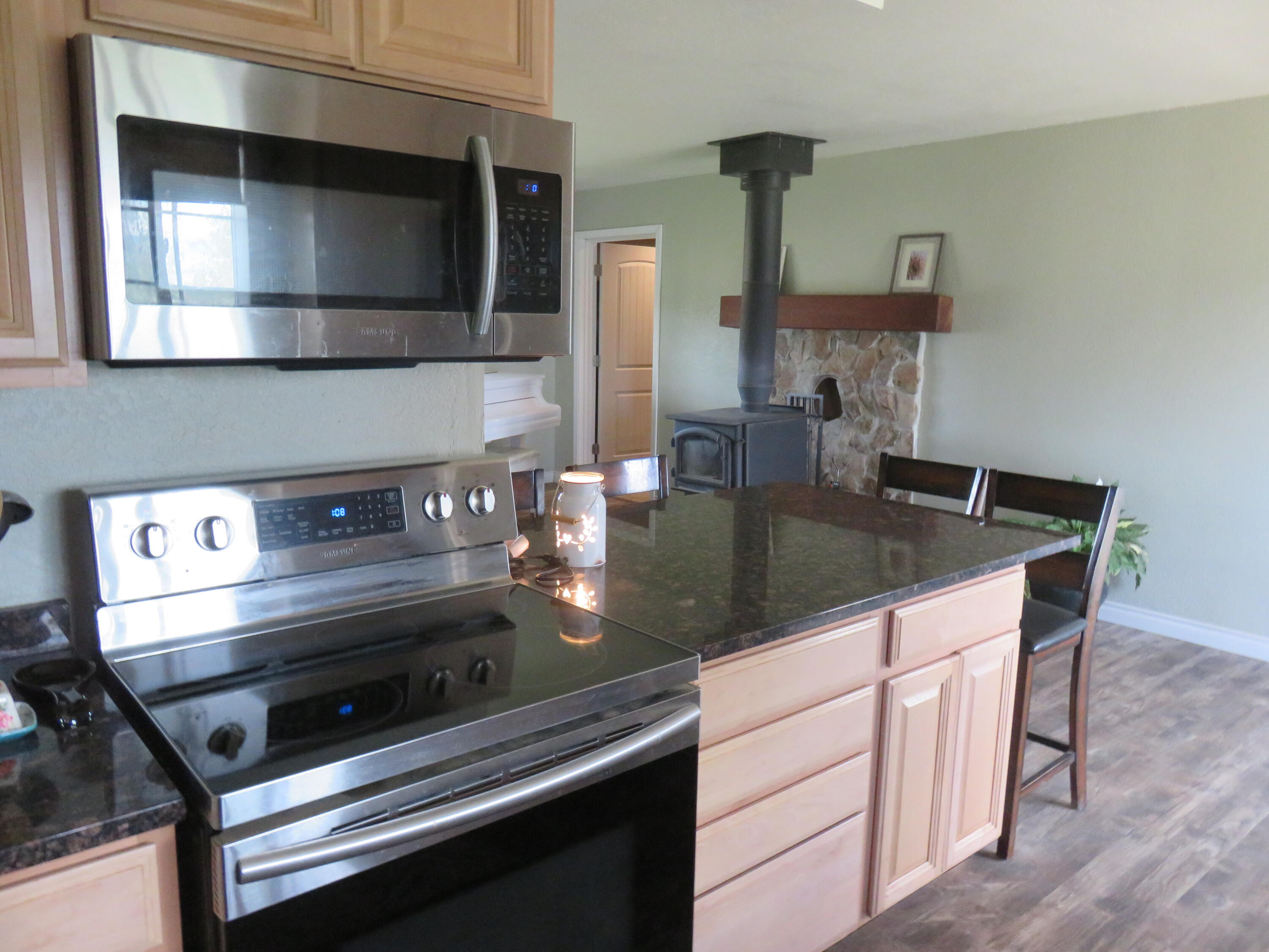 3798 County Road 91 Lookout, CA 96054 - Photo 24 of 54 a kitchen with kitchen island a sink appliances and cabinets