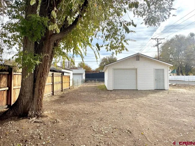 a house with a tree in front of it