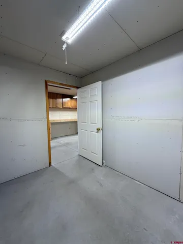 an empty room with a empty space and windows