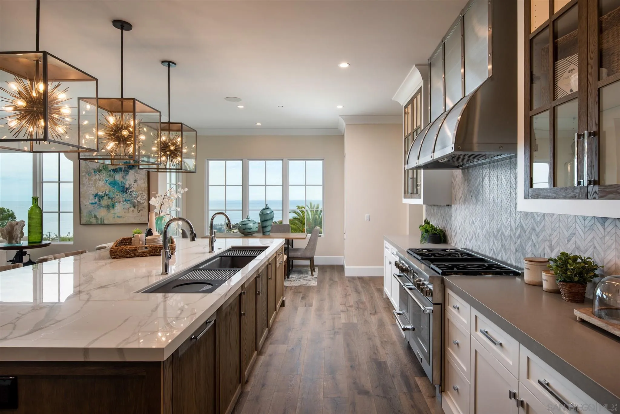 1206 Muirlands Drive La Jolla, CA 92037 - Photo 16 of 75 a kitchen with granite countertop a sink a counter space appliances and cabinets