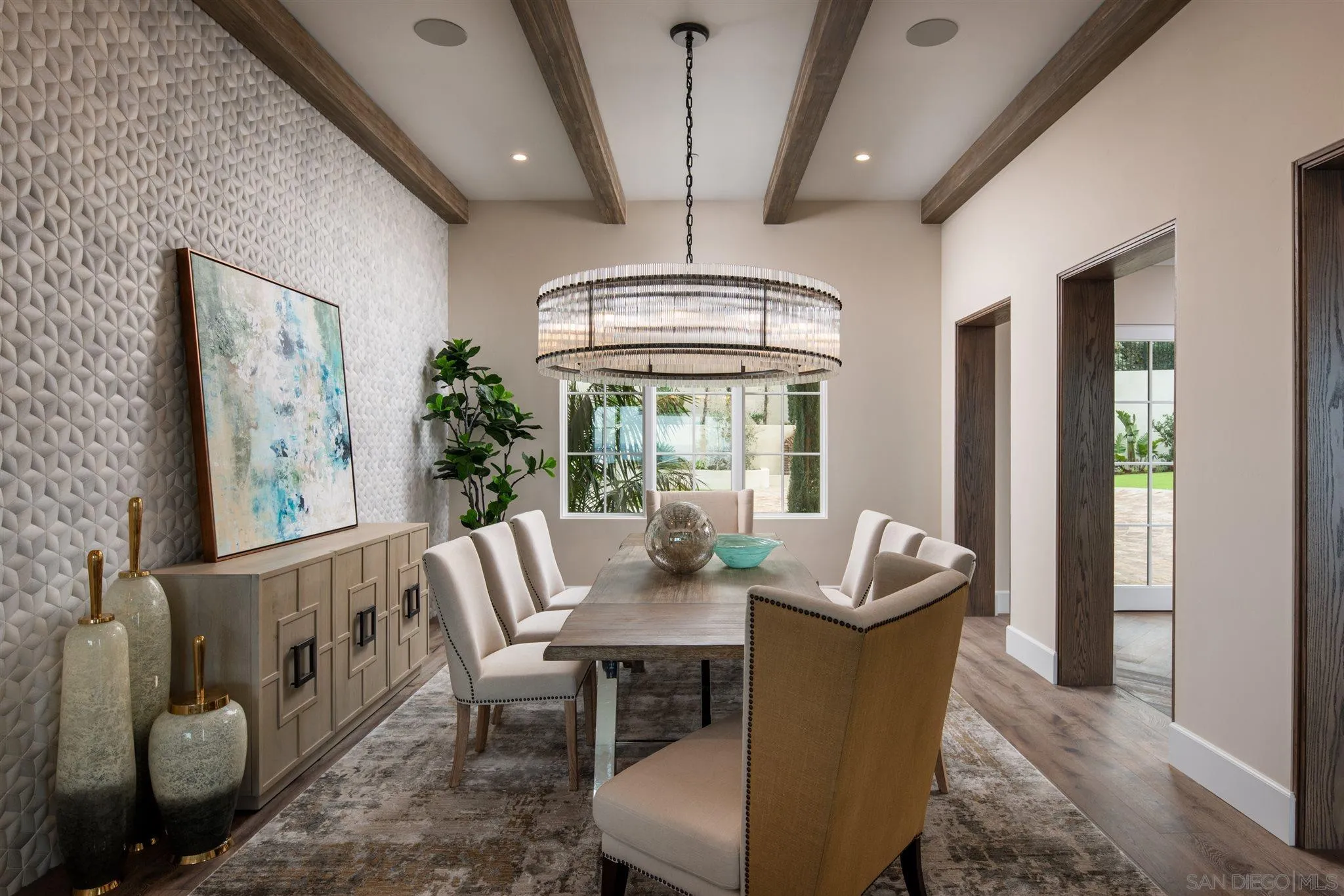 1206 Muirlands Drive La Jolla, CA 92037 - Photo 20 of 75 a dining room with furniture a chandelier and wooden floor
