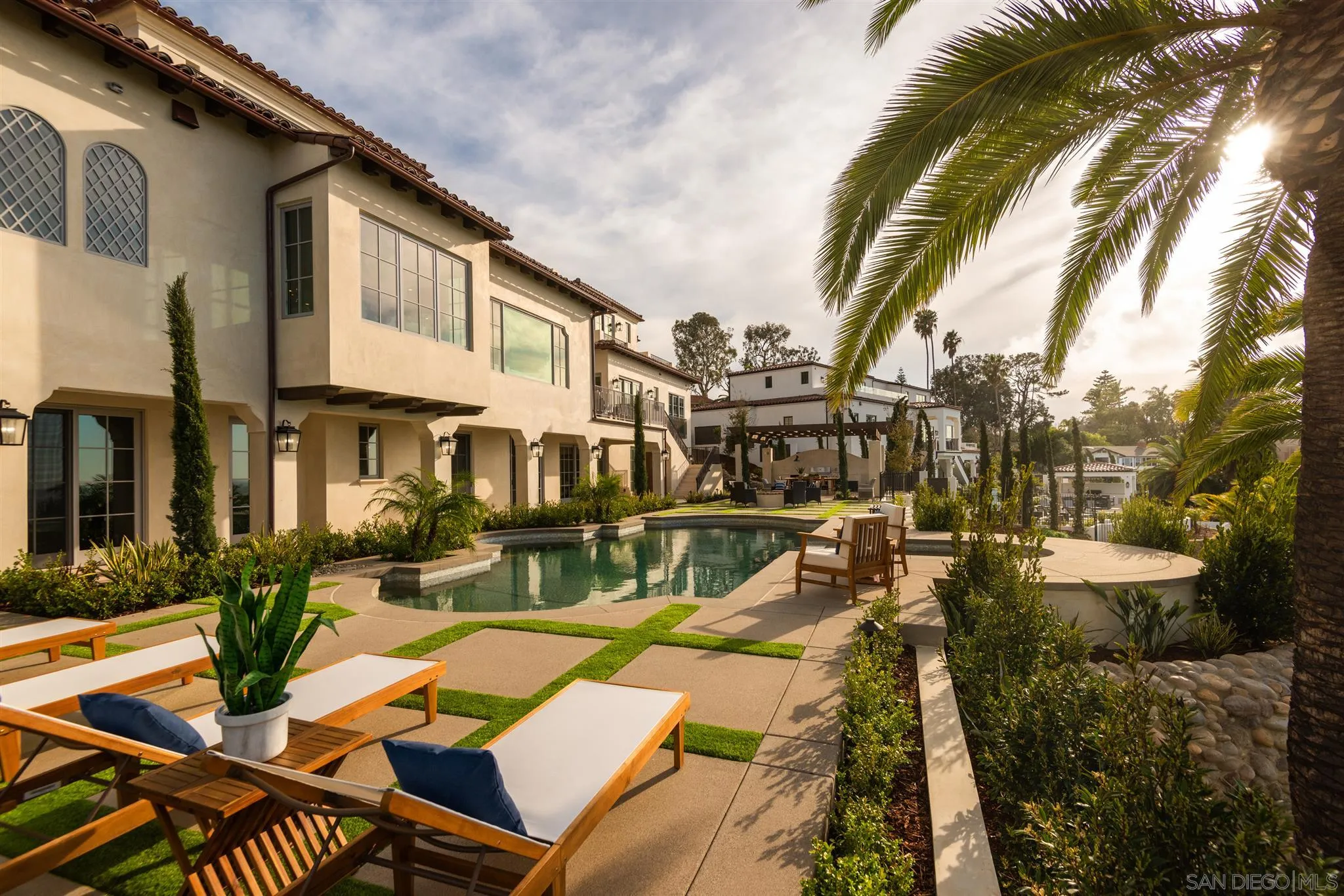 1206 Muirlands Drive La Jolla, CA 92037 - Photo 36 of 75 a view of a patio with couches table and chairs and potted plants
