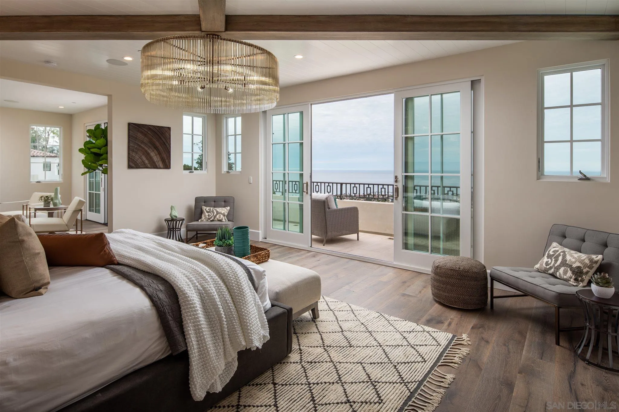 1206 Muirlands Drive La Jolla, CA 92037 - Photo 51 of 75 a bedroom with a bed and large windows