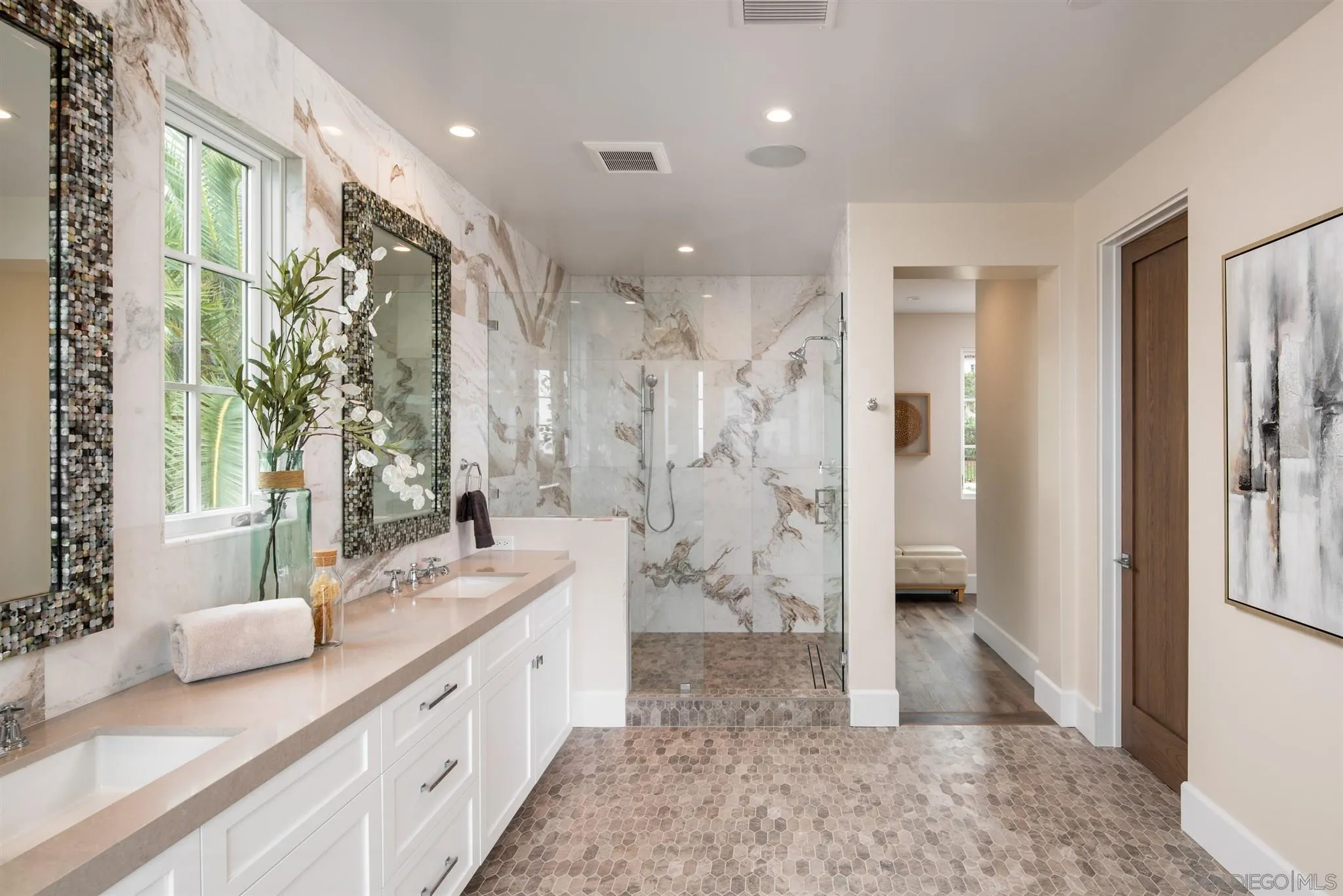 1206 Muirlands Drive La Jolla, CA 92037 - Photo 56 of 75 a spacious bathroom with a double vanity sink a mirror and a shower