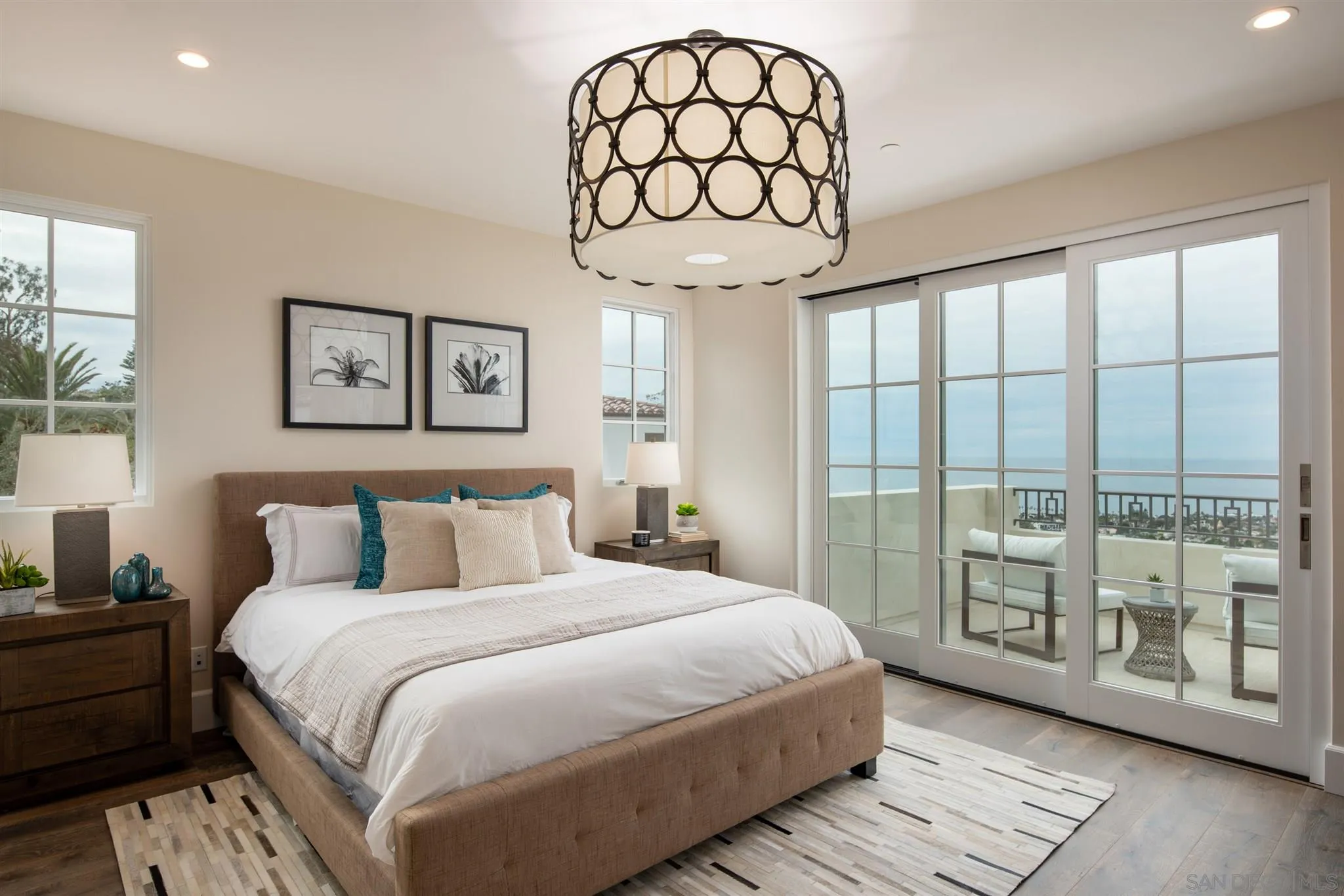 1206 Muirlands Drive La Jolla, CA 92037 - Photo 58 of 75 a bedroom with a large bed and a large window