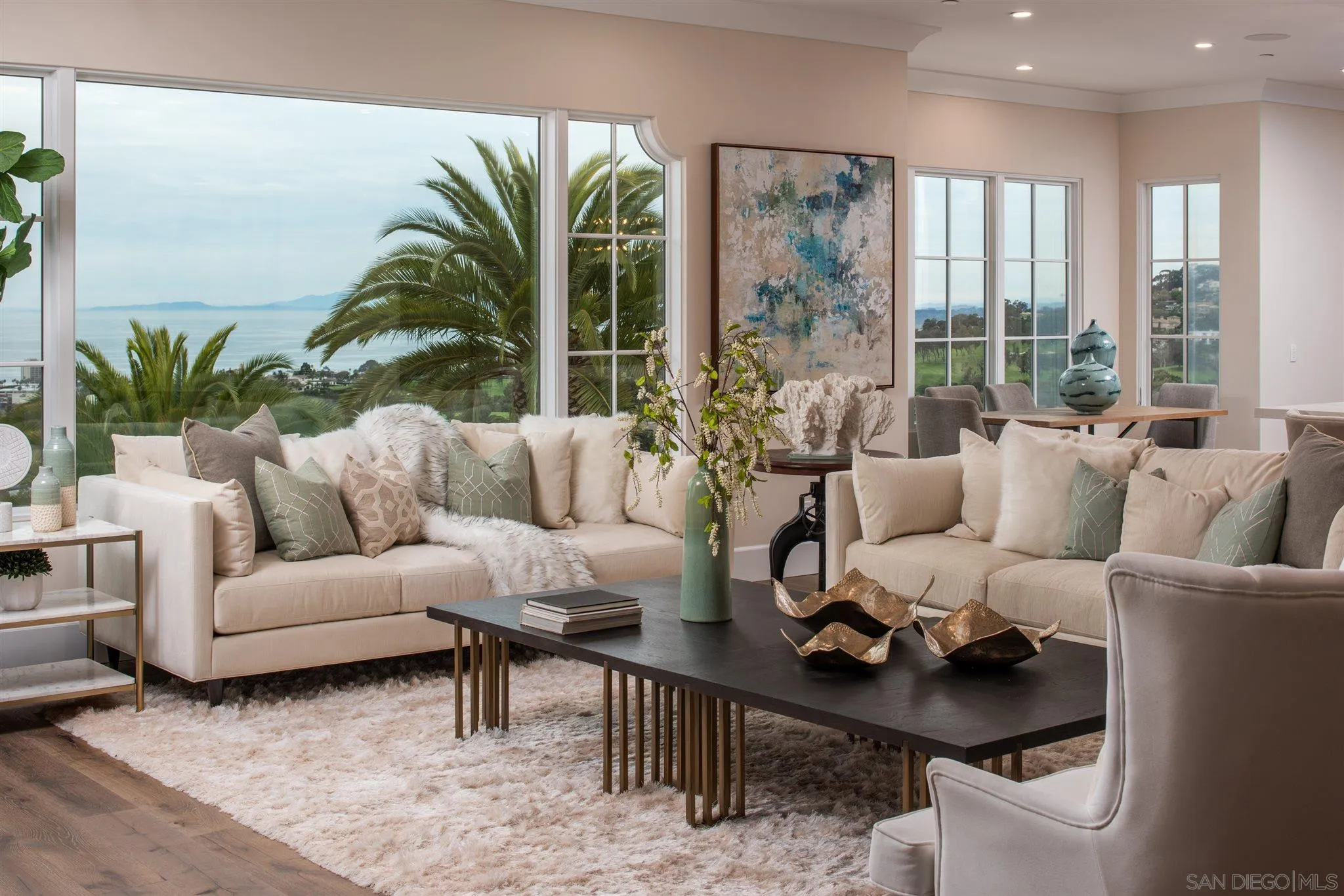 1206 Muirlands Drive La Jolla, CA 92037 - Photo 9 of 75 a living room with furniture and large windows