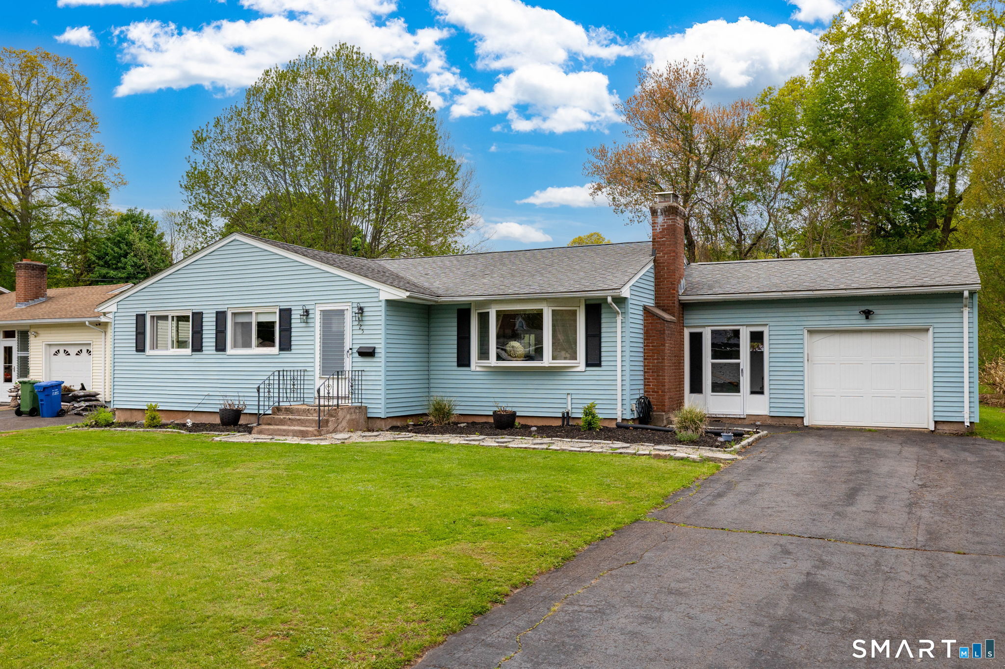 325 Barbara Road Middletown, CT 06457 - Photo 2 of 40 a front view of a house with a yard and garage