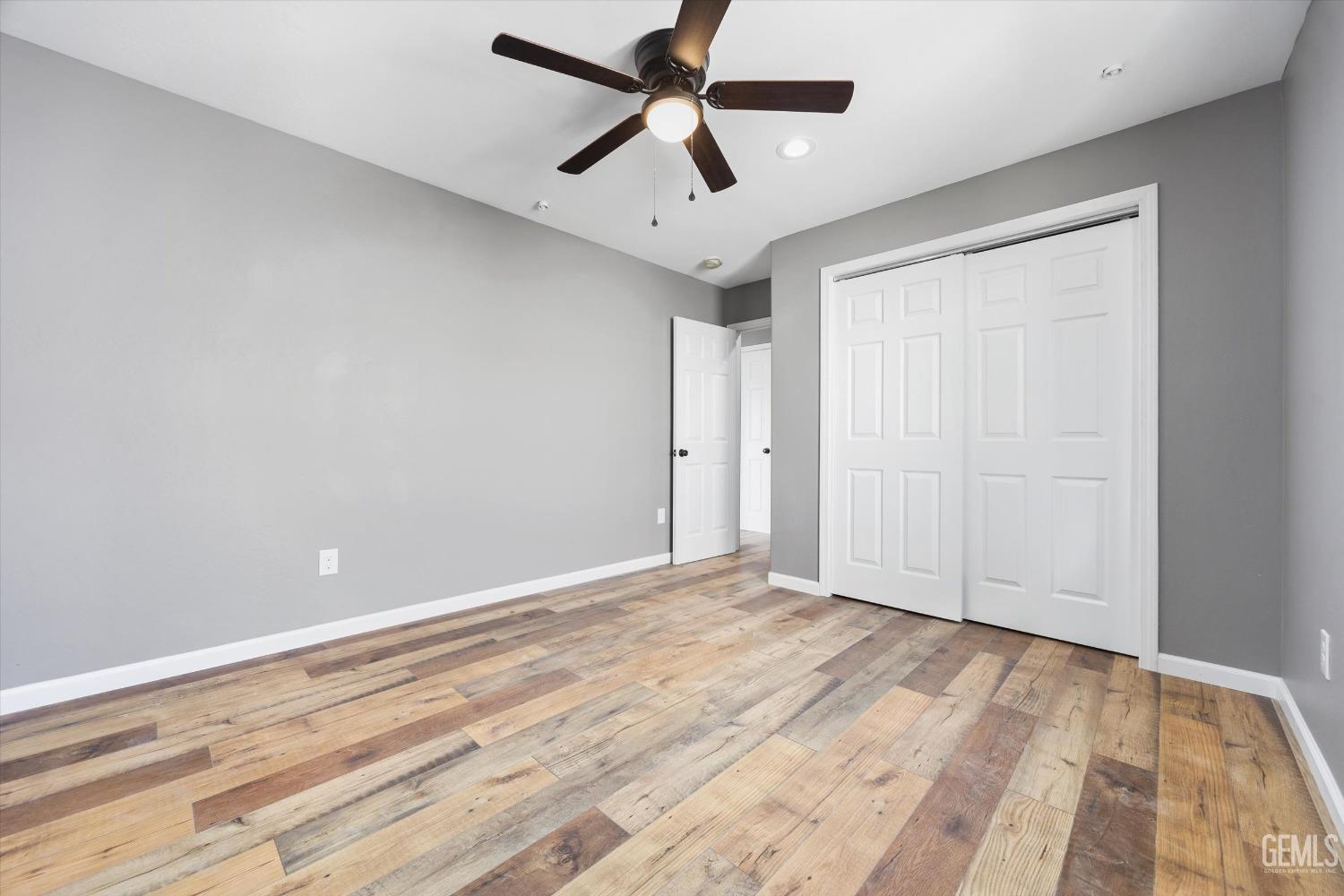 Undisclosed Address Bakersfield, CA 93307 - Photo 21 of 22 wooden floor in an empty room