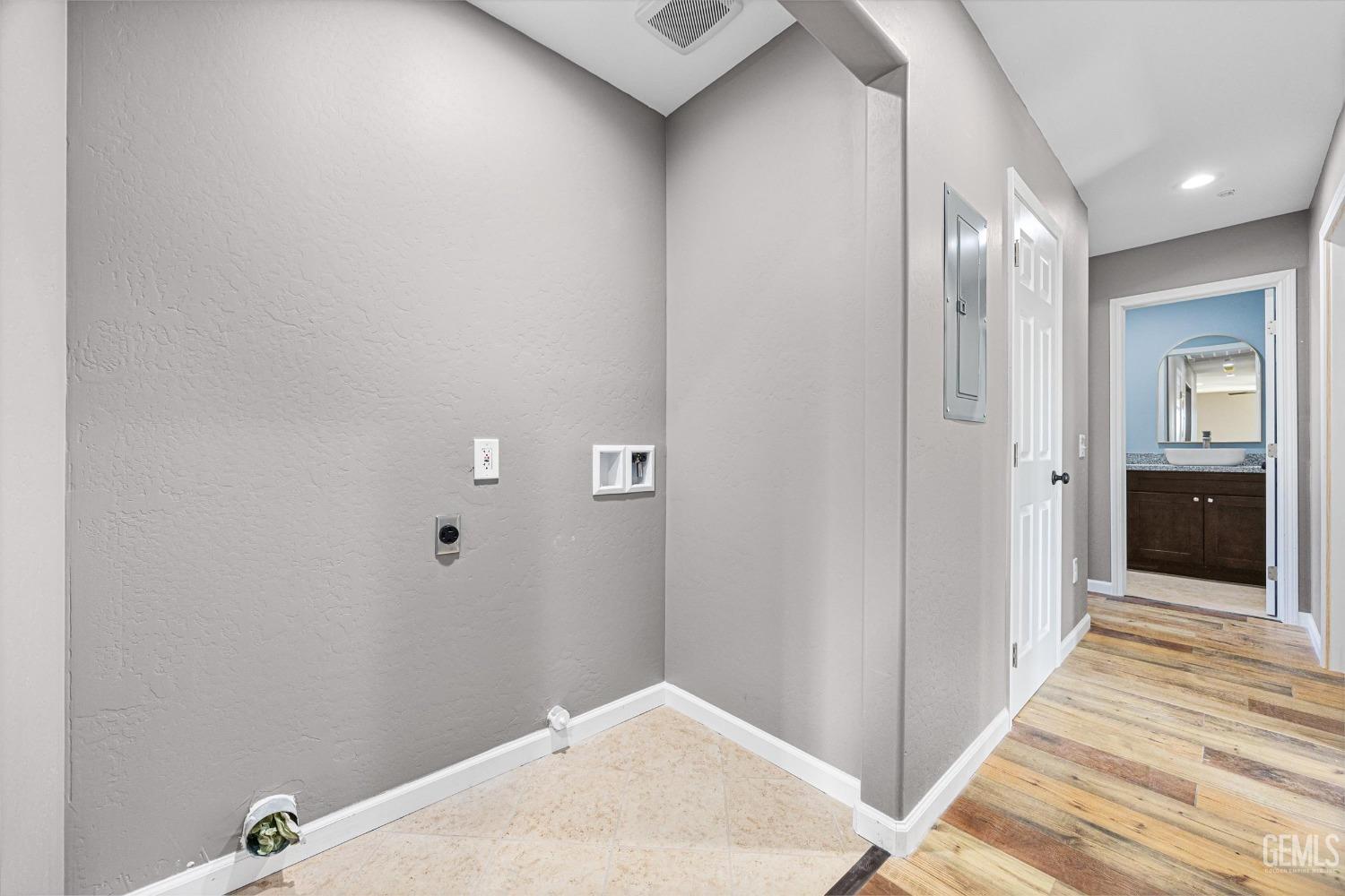 Undisclosed Address Bakersfield, CA 93307 - Photo 22 of 22 a view of a hallway with wooden floor